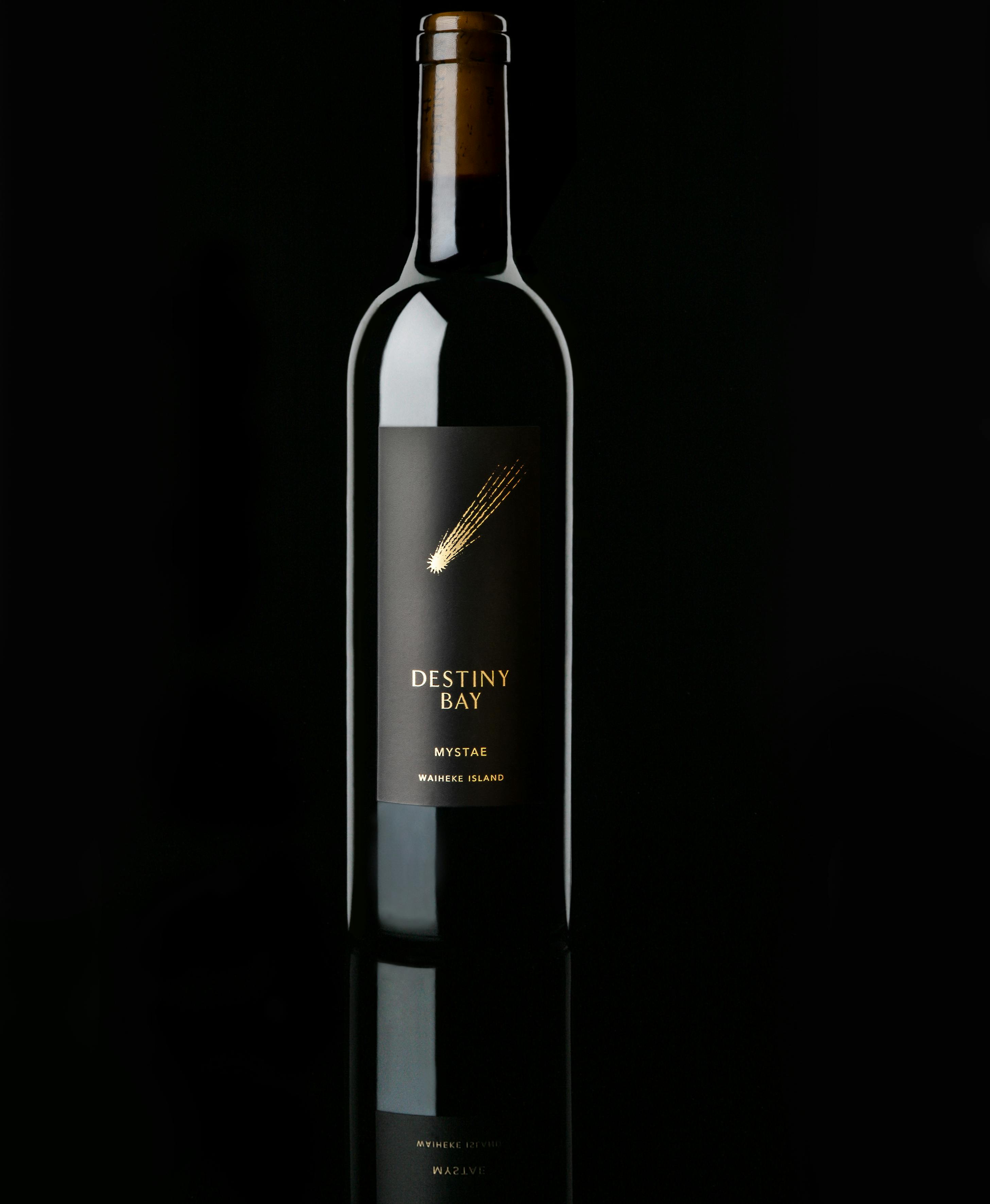 Wine bottle with 'Destiny Bay' label on a black background